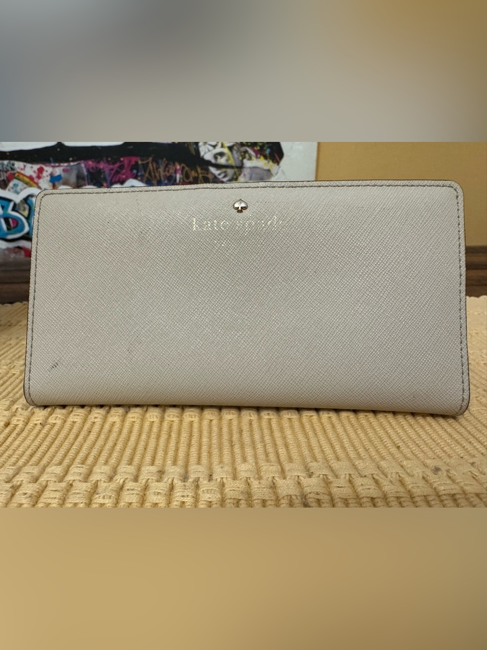 kate spade cream textured wallet with gold logo